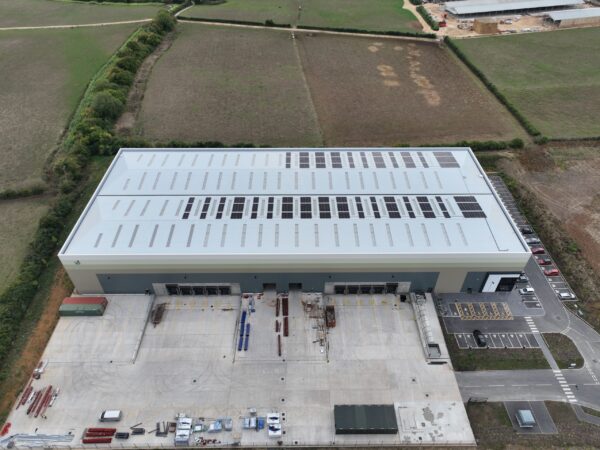 Solar panels on half of warehouse roof