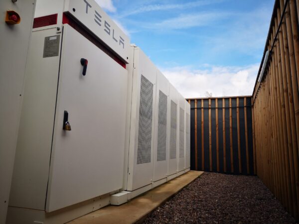 tesla megapack battery helping a community to generate energy