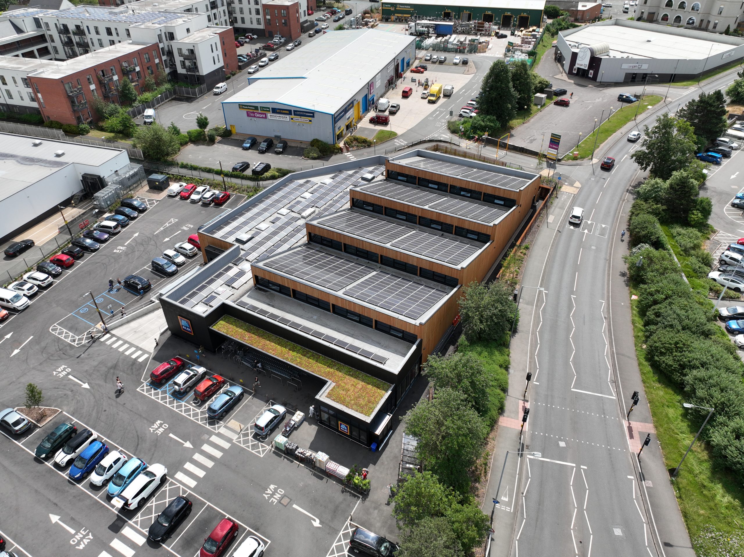 solar panels installed on top of an eco friendly aldi supermarket front view