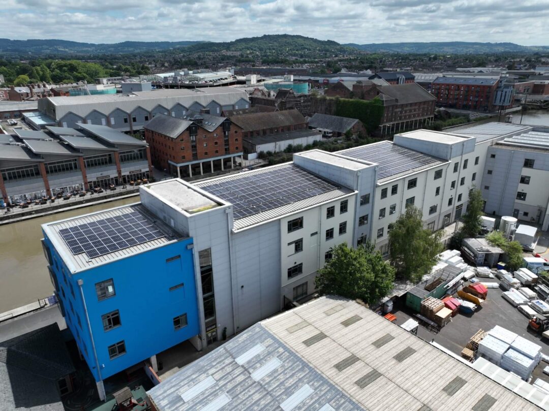 College building's flat roof adorned with solar panels