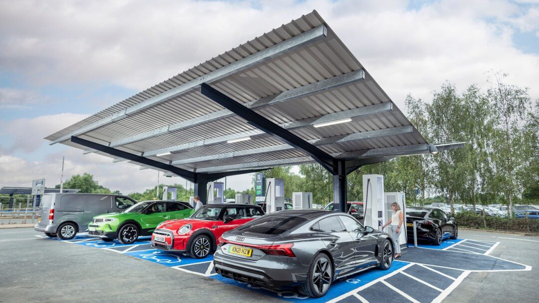 Electric vehicles parked beneath a solar carport canopy