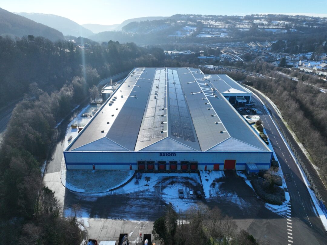 axiom building with solar panels on the roof