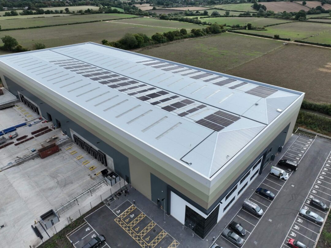 Warehouse roof sporting solar panels on one side