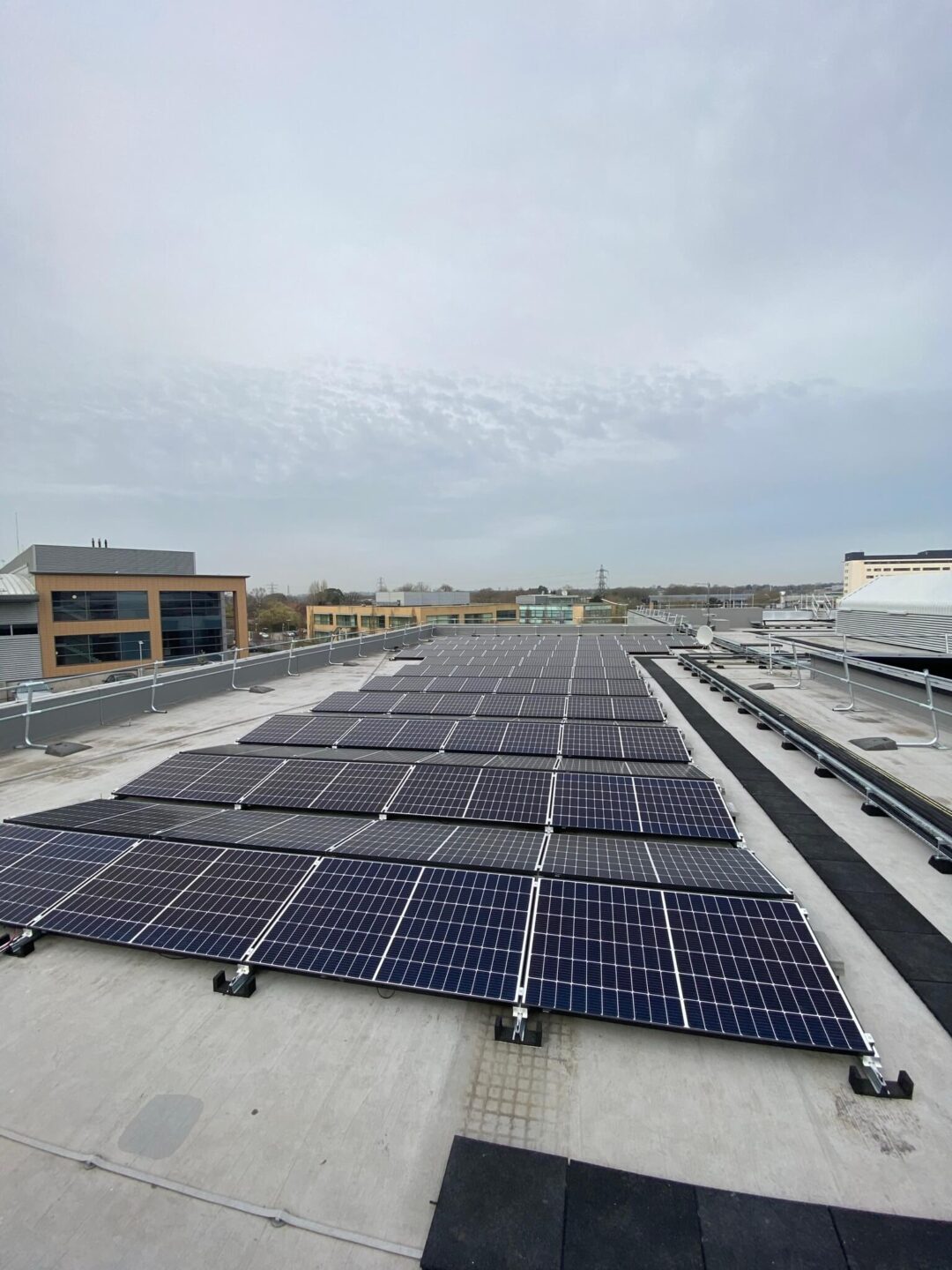 Solar panels on a roof adjacent to scaffolding structure