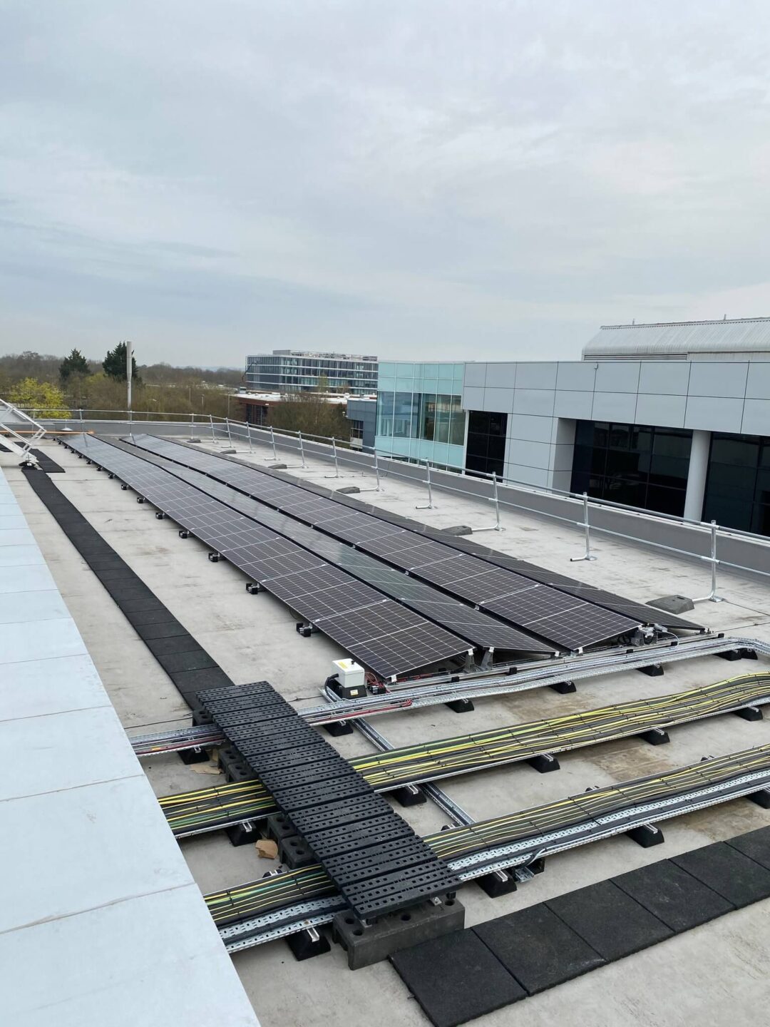 solar panels on a roof next to scaffolding